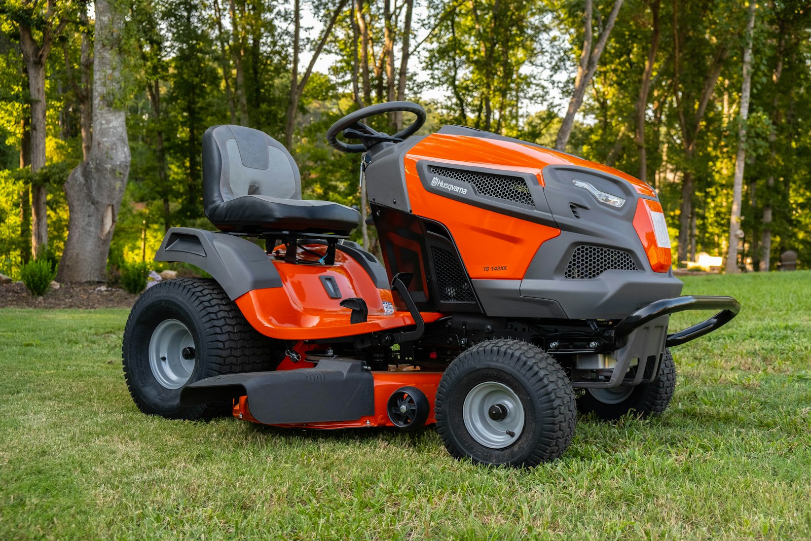 Zero-turn mower on a wide, flat Arizona lot mid-cut.